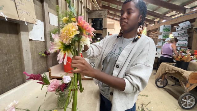 Christa Barfield arranges flowers 