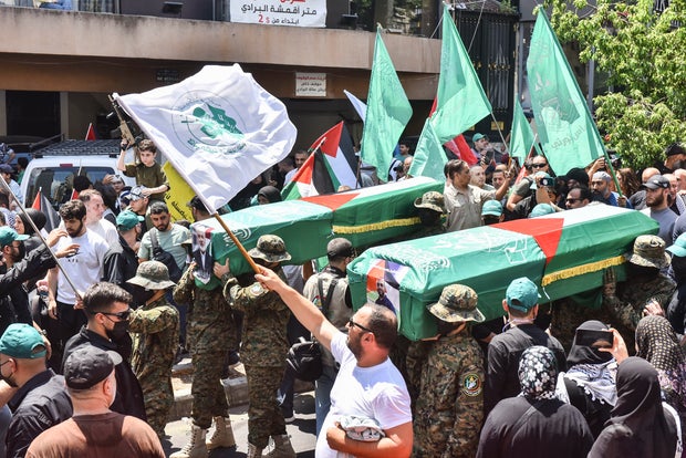 Members of the Palestinian Joint Action Committee hold a rally and a symbolic funeral for late Hamas leader Ismail Haniyeh in Beirut, Lebanon