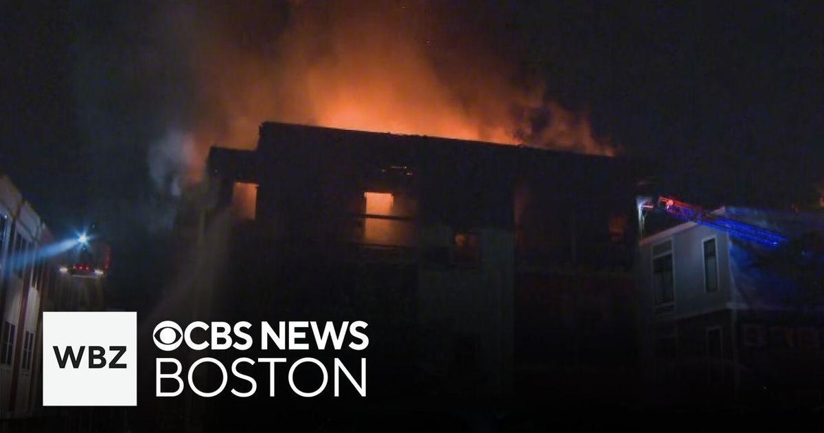 Dozens of people rush to escape fire tearing through Massachusetts apartment building