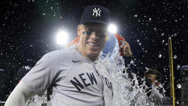 Aaron Judge #99 of the New York Yankees is doused with water after the game against the Chicago White Sox during which, in the eighth inning, Judge hit his 300th career home run at Guaranteed Rate Field on August 14, 2024 in Chicago, Illinois. 