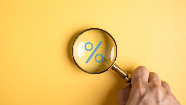 Percentage sign of Magnifier glass focus to percentage icon with percent symbol,  interest rate and business profit growth concept. 