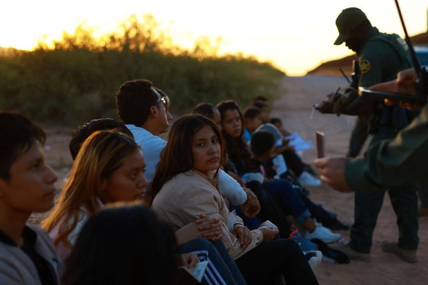 Migrants are detained by U.S. Border Patrol agents in New Mexico