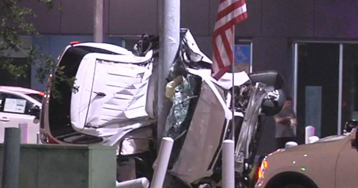 Police investigate fatal accident in Doral in which a car wrapped around a pole