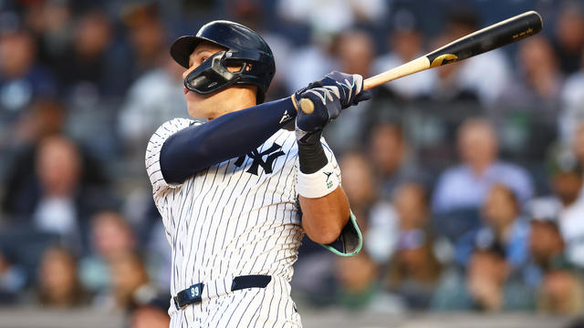 Aaron Judge #99 of the New York Yankees hits a home run in the first inning against the Cleveland Guardians at Yankee Stadium on August 20, 2024 in New York City. 