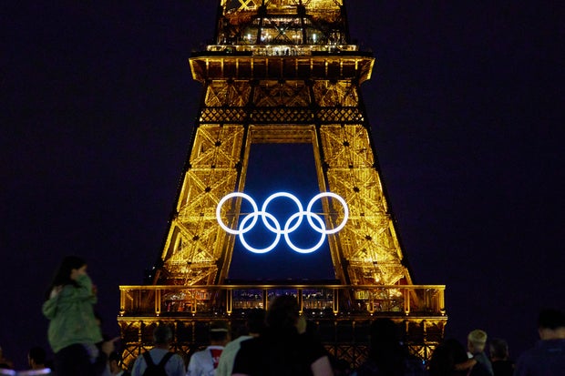 The Olympic rings are displayed on the Eiffel Tower at night between the Paris 2024 Olympic and Paralympic Games in Paris on August 19, 2024