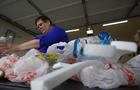 Brandy Deason sorting through plastic waste 