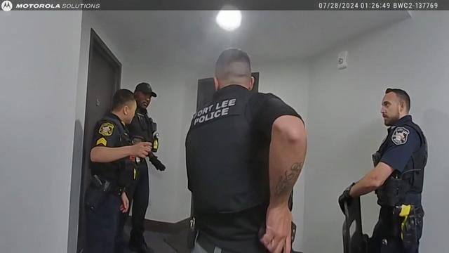 Body cam video shows four Fort Lee Police officers standing outside an apartment. 