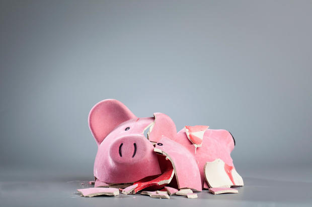 Broken Piggy Bank Against Gray Background 