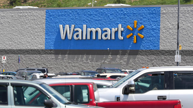 Cars fill the parking lot of the Walmart store at the 