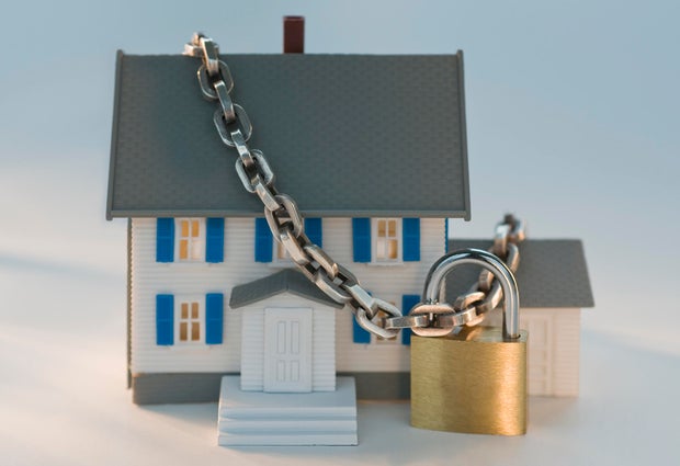 Model house locked with chain