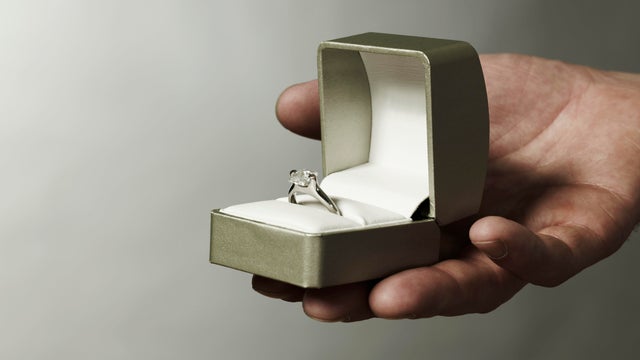 Man holding engagement ring