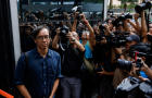 Chung Pui-kuen, former chief editor of the now-shuttered Stand News, leaves the district court on bail after the verdict in a landmark sedition trial in Hong Kong 