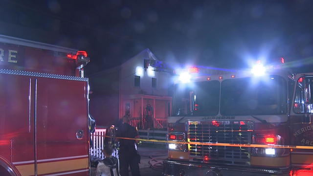 Fire trucks are seen at the site of a house fire in Ardmore 