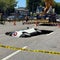 2 injured as sinkhole opens, swallowing SUV on road in central Seoul