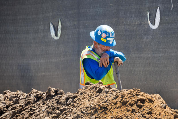 Construction workers work amidst a heat wave in Irvine 