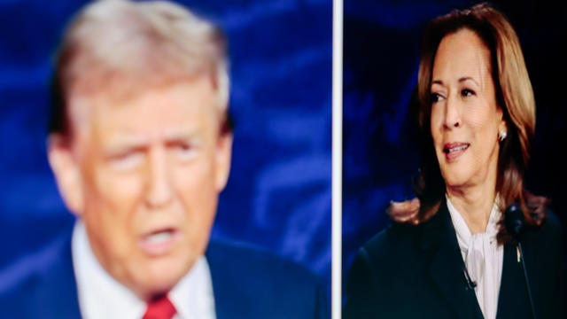 Former President Donald Trump and Vice President Kamala Harris are shown on screen in the spin room during the second presidential debate at the Pennsylvania Convention Center in Philadelphia, Pennsylvania, US, on Tuesday, Sept. 10, 2024. 