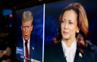 Former President Donald Trump and Vice President Kamala Harris are shown on screen in the spin room during the second presidential debate at the Pennsylvania Convention Center in Philadelphia, Pennsylvania, US, on Tuesday, Sept. 10, 2024. 