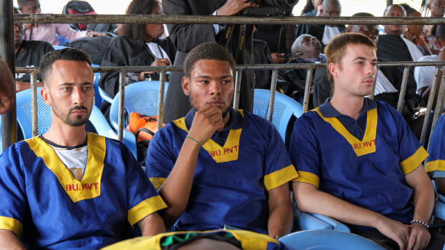 Benjamin Reuben Zalman-Polun, Marcel Malanga and Taylor Thompson, American citizens suspected along with a group of around 50 other people to be involved in an attempted coup in Congo, wait for the final verdict during their trial in Kinshasa, Congo, Sept 