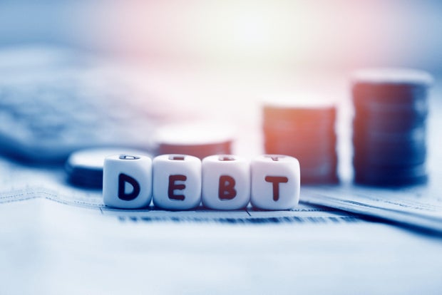 Debt credit card and money coin stack / Increased liabilities from exemption debt consolidation of financial crisis and problems risk business management loan interest