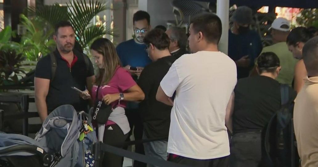 People line up in front of Miami Beach Apple store to be the first to get an iPhone 16 People line up in front of Miami Beach Apple store to be the first to get an iPhone 16