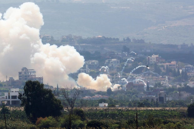 Smoke billows over southern Lebanon following Israeli strikes, as seen from Tyre, southern Lebanon
