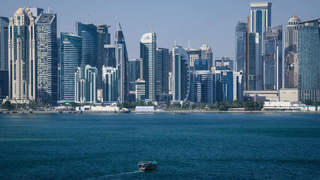 A boat passes in front of the skyline of Doha, Qatar, on Nov. 29, 2023. 