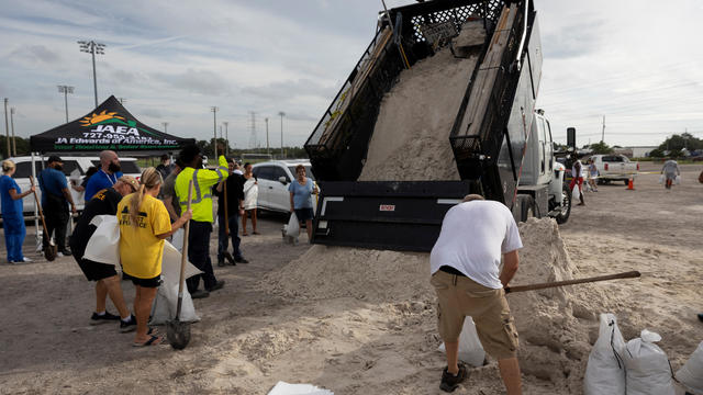 People fill up sandbags at Joe DiMaggio Sports Complex before Helene's expected landfall on Florida's Big Bend, in Clearwater, Florida, Sept. 25, 2024. 