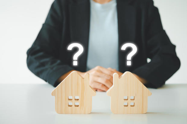 Planning to buy property. Choose what's the best. loan concepts.	Small House Model With Question Marks, Planning to buy property. Choose what's the best. A symbol for construction. 