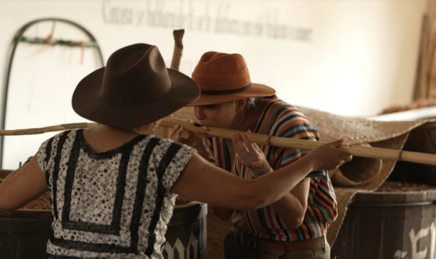 Cecilia Vega learns about the mezcal making process from Graciela Ángeles Carreño. 