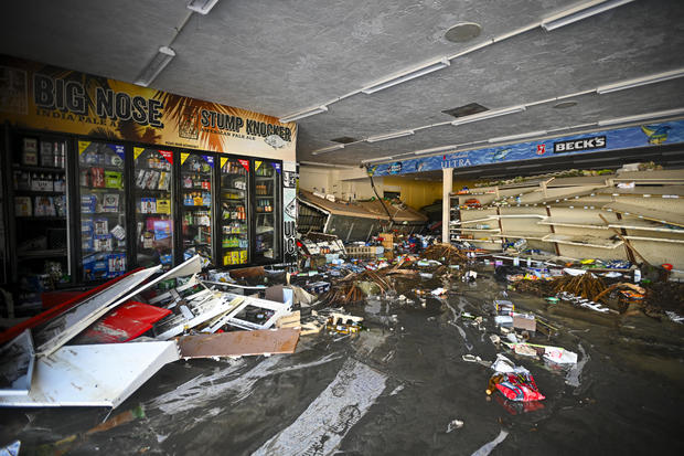 Debris is seen inside a flooded store after Hurricane Helene made landfall, in Cedar Key, Florida, on Sept. 27, 2024. 