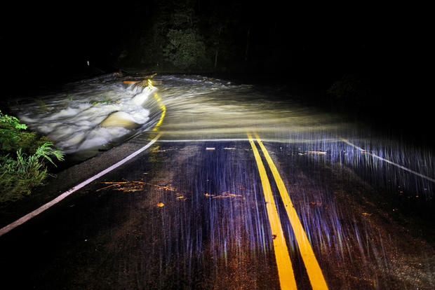 Floodwaters wash over Guy Ford Road bridge on the Watauga River as Hurricane Helene approaches in the North Carolina mountains, in Sugar Grove, North Carolina, on the night of Sept. 26, 2024. 