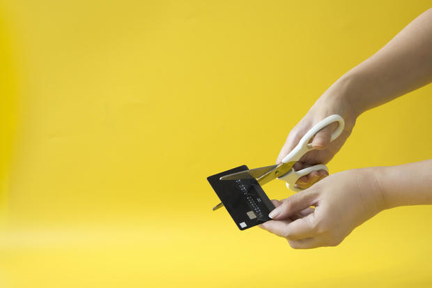 Hand cutting credit card - stock photo. 