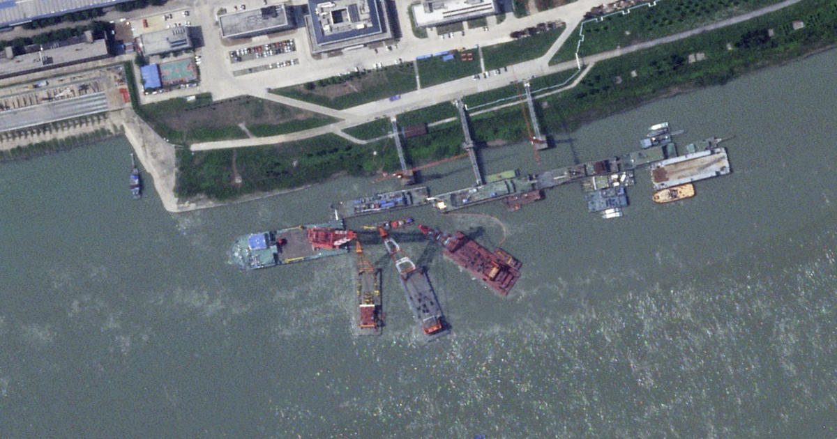 Satellite imagery showed that China's newest nuclear-powered attack submarine sank alongside a pier while under construction, a U.S. military official