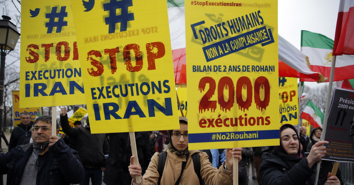 Iran publicly executes two men for killing a police officer during an armed robbery