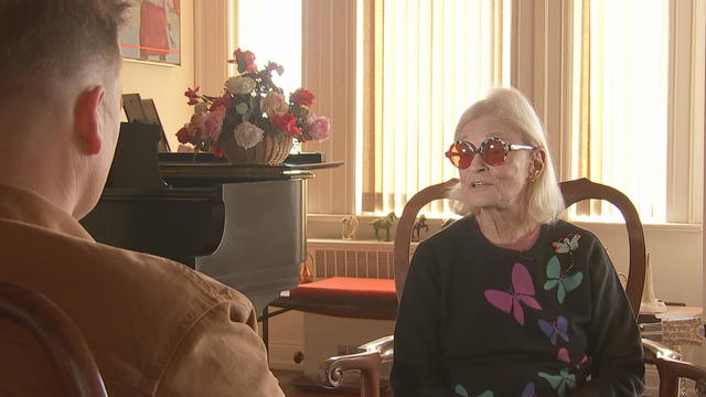 Bettyruth Walter speaks to a reporter from her apartment 