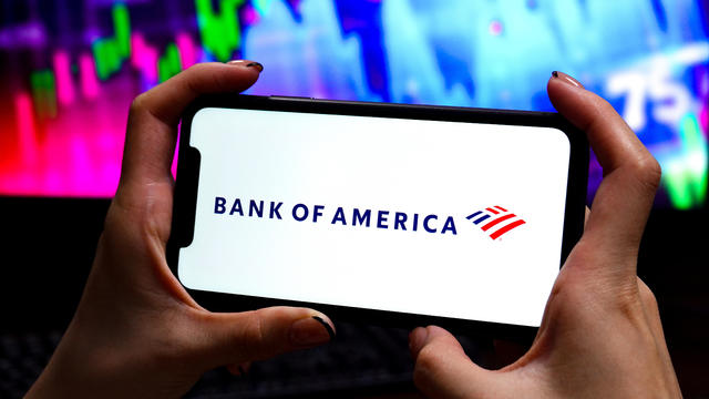 In this photo illustration, a Bank of America logo is 