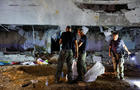 Israeli rescue force secures the site where a missile fired from Iran towards Israel hit a school building in central Israel 