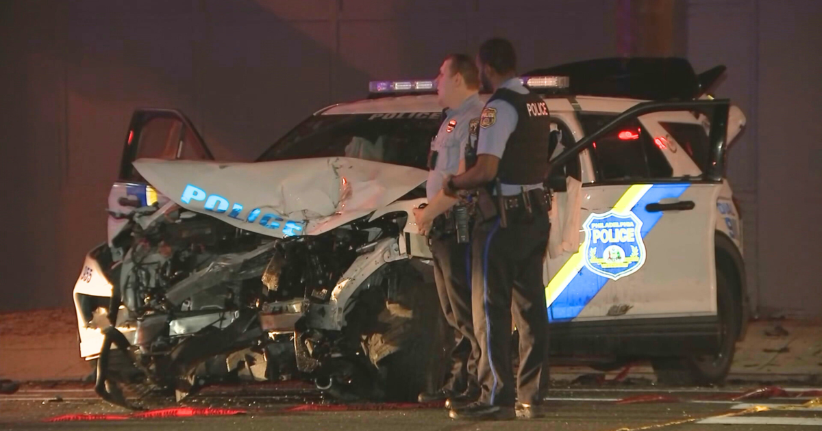 A Philadelphia officer and three other people were hospitalized after a patrol car collided with an SUV