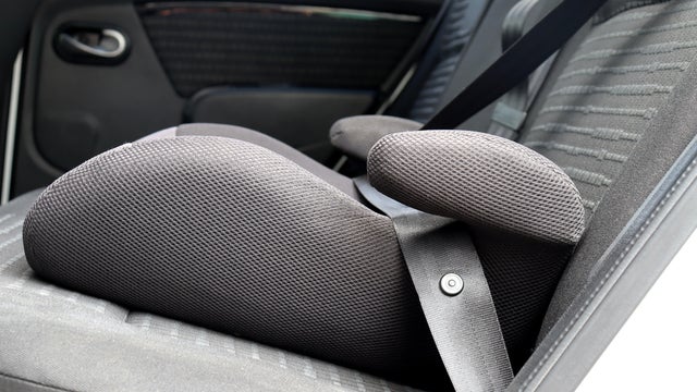 Safety booster seat for children. Car interior.
