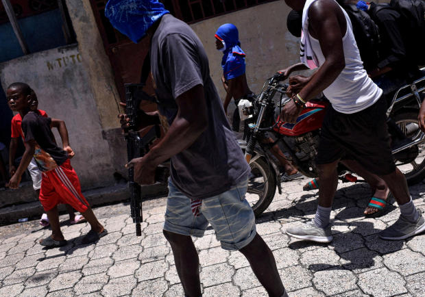 FILE PHOTO: The Wider Image: Camping in schools, hungry Haiti families ask: when will normality return? 