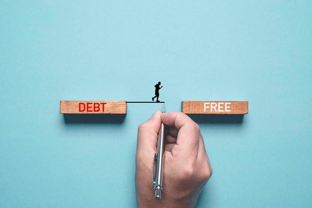 Hand writing line to connect between deb and free wording for solving business consumer burden financial debt or borrow mortgage failure crisis concept.