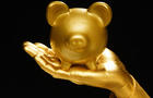 Golden hand and piggie bank 