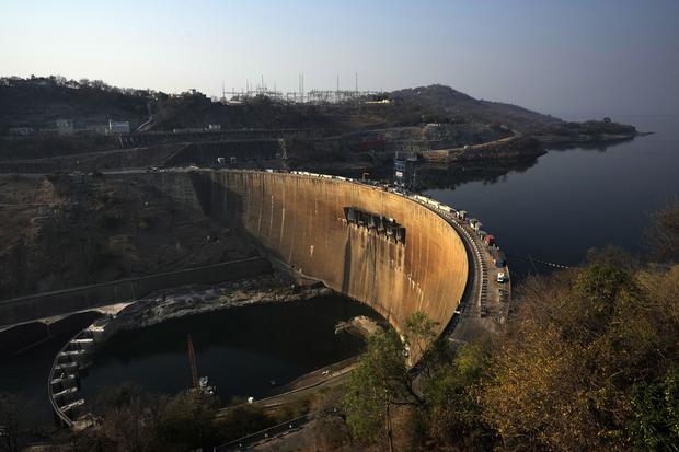 The world's largest man-made lake is being parched by drought, depriving Zambia of its electricity