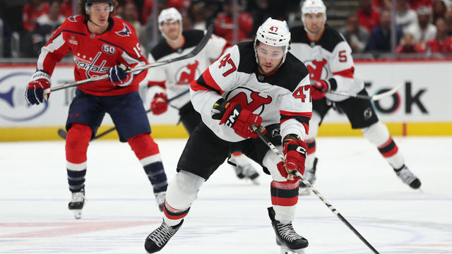 Paul Cotter #47 of the New Jersey Devils skates up the ice with the puck against the Washington Capitals during the first period at Capital One Arena on October 12, 2024 in Washington, DC. 