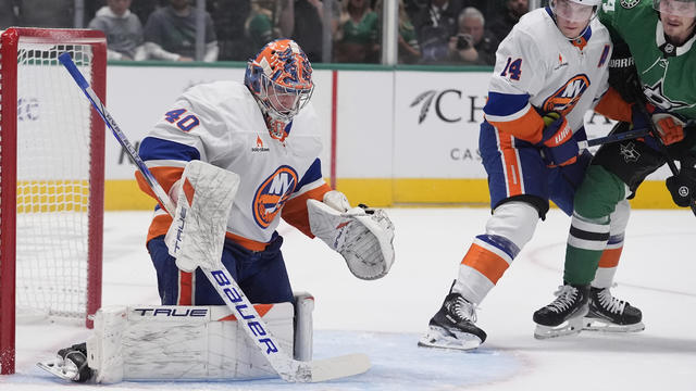 New York Islanders goaltender Semyon Varlamov (40) and center Bo Horvat (14) defend the goal against Dallas Stars center Roope Hintz (24) during the first period of an an NHL hockey game, Saturday, Oct. 12, 2024, in Dallas. 