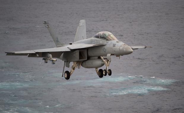 A Boeing EA-18G Growler lands on the deck of the USS George H.W. Bush aircraft carrier in the Atlantic Ocean on Oct. 25, 2017, as the carrier strike group takes part in Operation Bold Alligator, a multinational warfare exercise hosted by the United States 