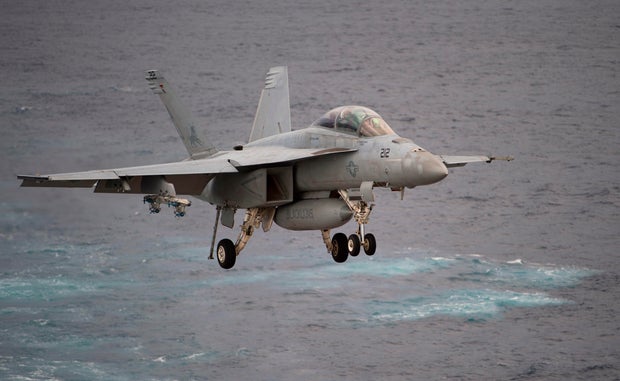A Boeing EA-18G Growler lands on the deck of the USS George H.W. Bush aircraft carrier in the Atlantic Ocean on Oct. 25, 2017, as the carrier strike group takes part in Operation Bold Alligator, a multinational warfare exercise hosted by the United States