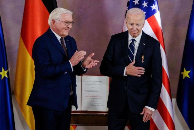 German President Frank-Walter Steinmeier awards President Biden the Federal Medal of Merit at Schloss Bellevue on Oct. 18, 2024, in Berlin, Germany. 