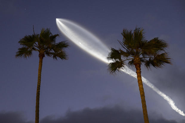 SpaceX Falcon 9 Rocket Launch At Sunset 