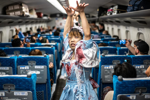 An actor performer for passengers during the 'Zombie Shinkansen' event on a bullet train from Tokyo to Osaka, ahead of Halloween